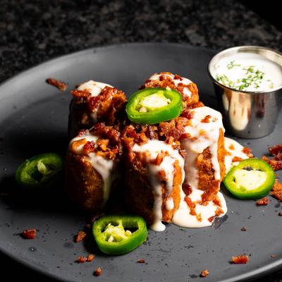 Monster Tots served with a side of house ranch.