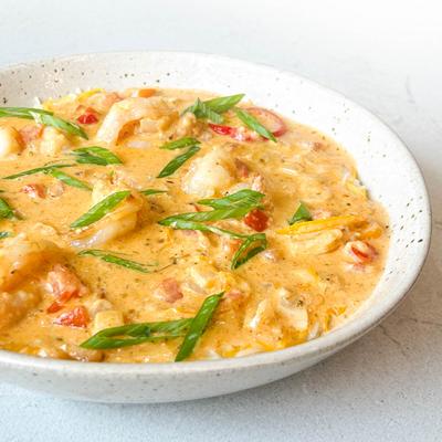 A bowl of creamy seafood dish.