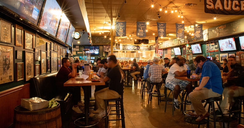 Crowded interior, guests eating and drinking
