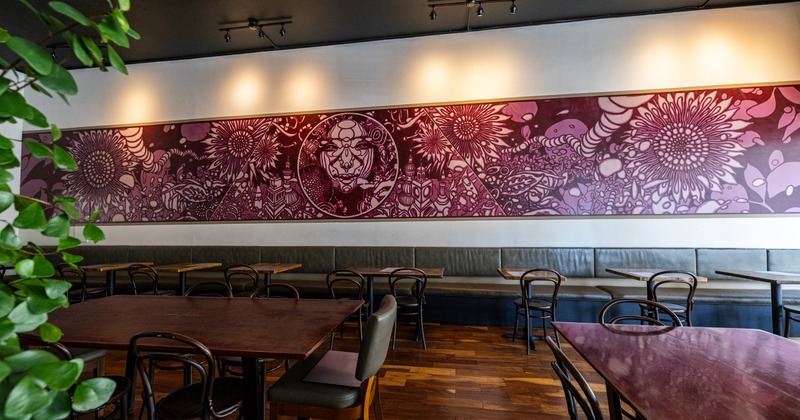 Diner area, tables, chairs, decorated wall