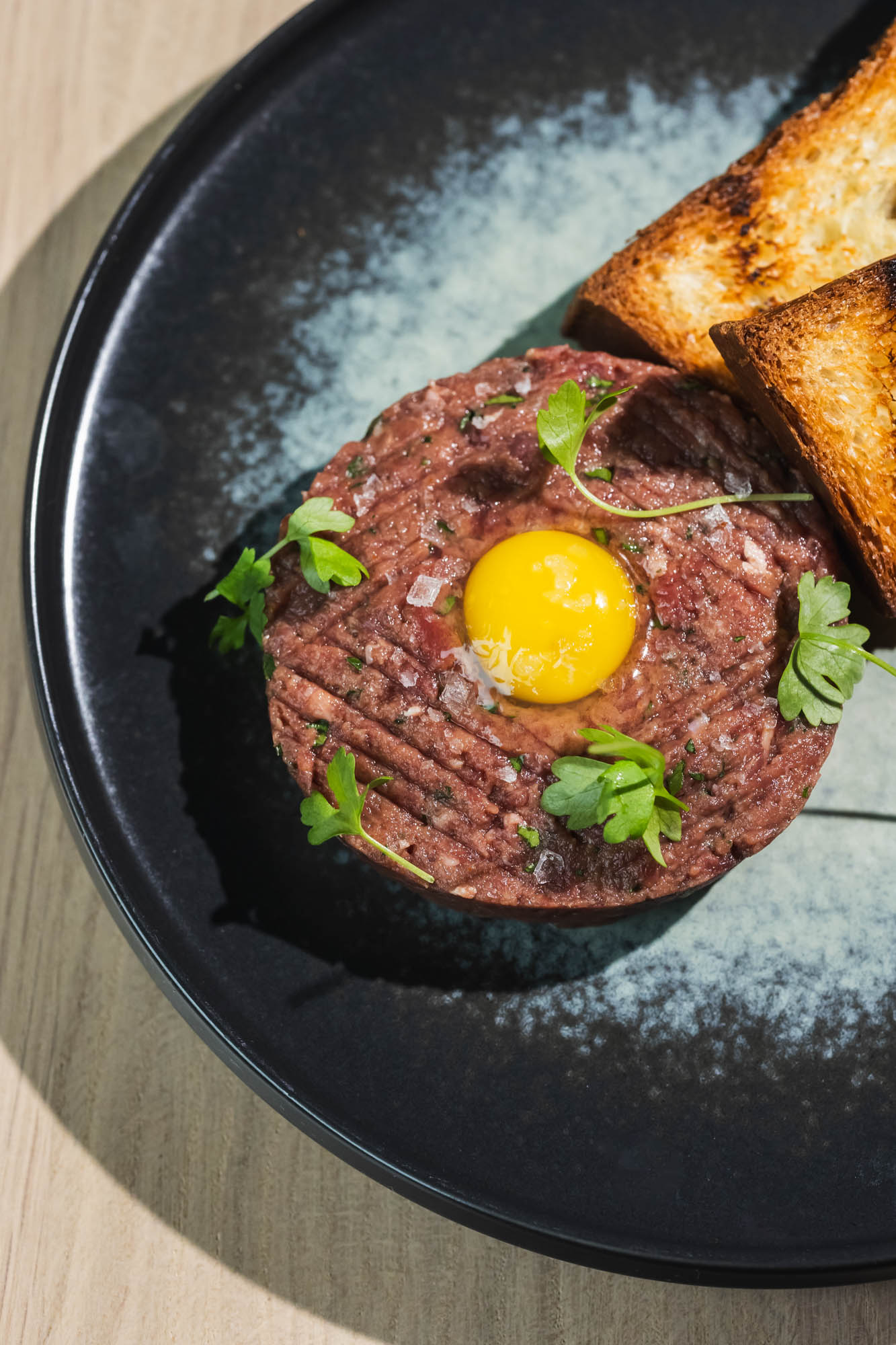 Beef Tartare, served with brioche and a quail egg