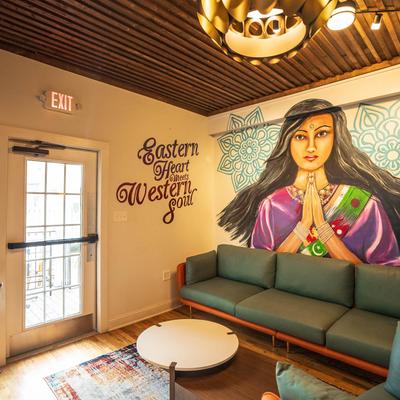 Interior space, lounge seating with  mural art.