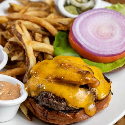 Hemlock Beef Burger with fries and dipping sauce.