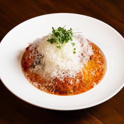 Spaghetti and meatballs, served on the table.