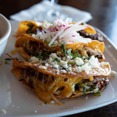 Quesabirria  Special, three tacos and consomme dipping sauce.