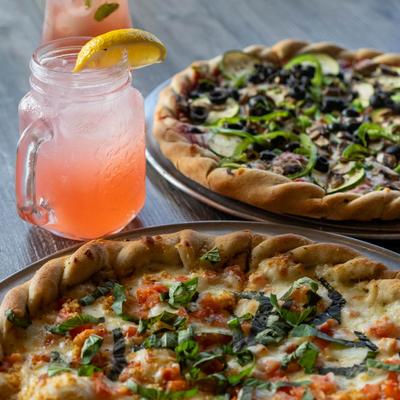 Margherita and Vegetarian pizza, accompanied with a fruit punch.