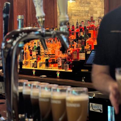 Glasses of beer and beer taps.