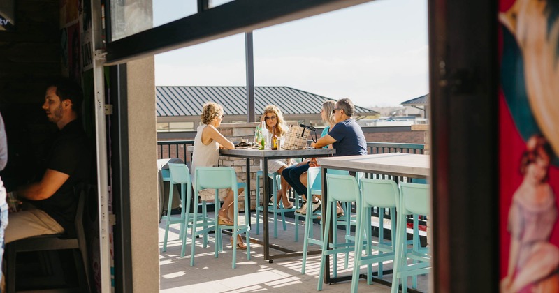 Exterior, terrace, tables and chairs, guests, view true window