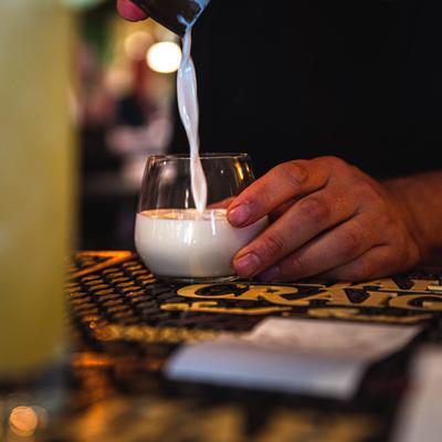 Bartender preparing a cocktail, hands closeup