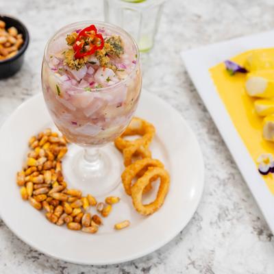 Peruvian ceviche accompanied by toasted corn and fried calamari.