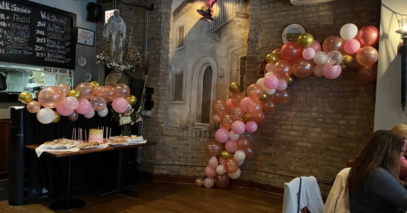 Interior, seating room with a buffet table and balloons