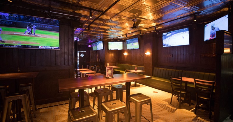 Interior, seating area, TVs on the walls