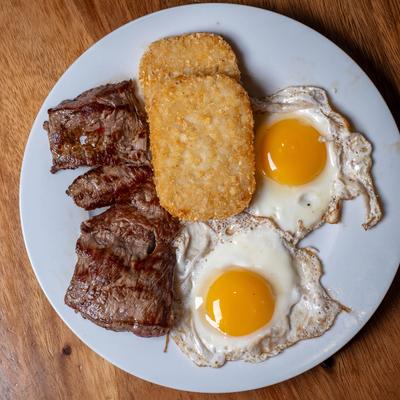 Steak and eggs with hash browns.