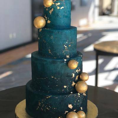 Four tier navy blue cake