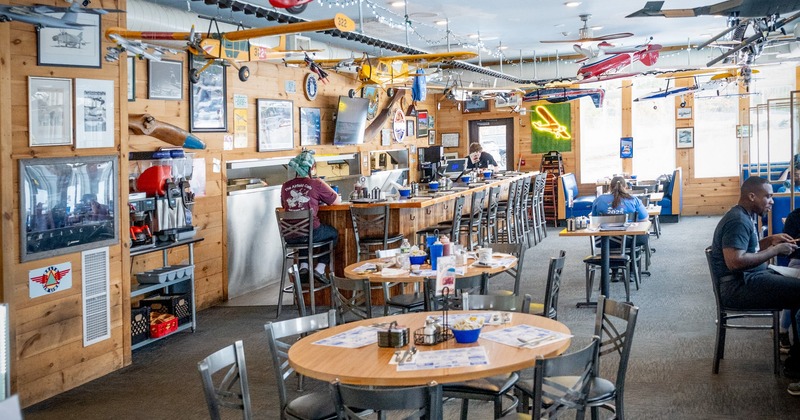 Interior, dining area with tables, chairs and a bar