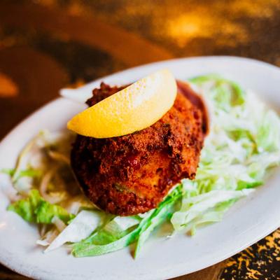Bread stuffing and chopped clams in a half-shell