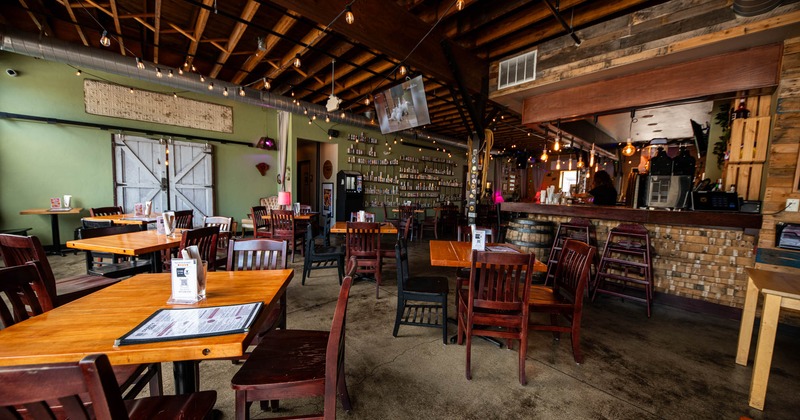Interior, dining area and the bar in the back