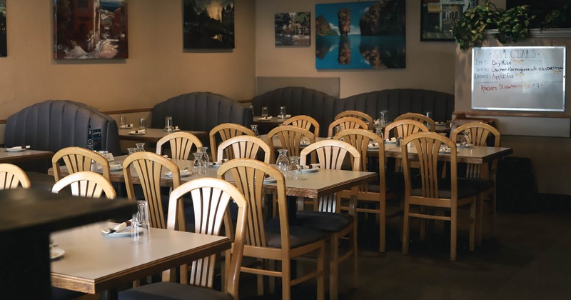 Interior, tables and chairs in dining area