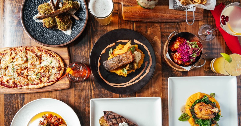 An assortment of dishes and drinks on a table, flat lay