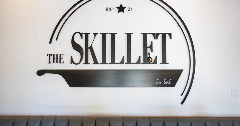 Skillet logo in black with cast iron pan