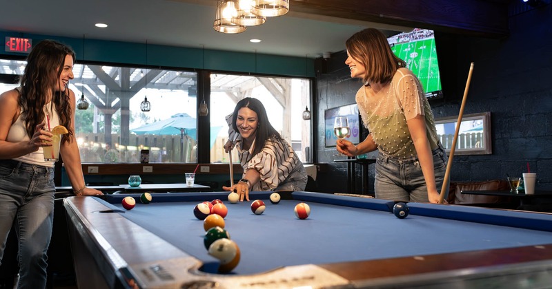 A group of friends enjoying a game of pool