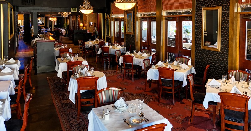 Cozy interior dining area with set tables ready for guests