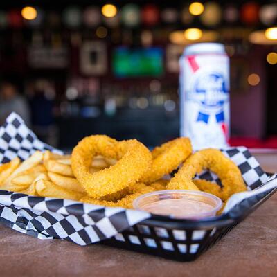 Basket of Frings and tall can of Pabst Blue Ribbon beer