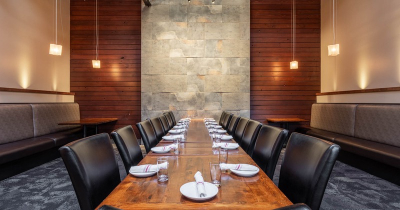 A long table with chairs in a separate room