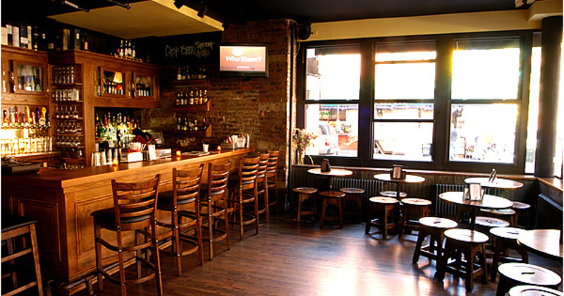 Interior, bar and seating area next to the windows