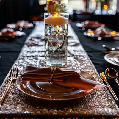 Dining plate, with utensils, napkins, and a glass.