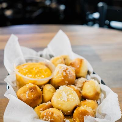 Pretzel bites, served with a dip.