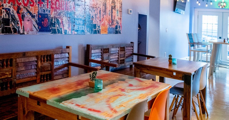 Interior details, modern wall art, tables lined up