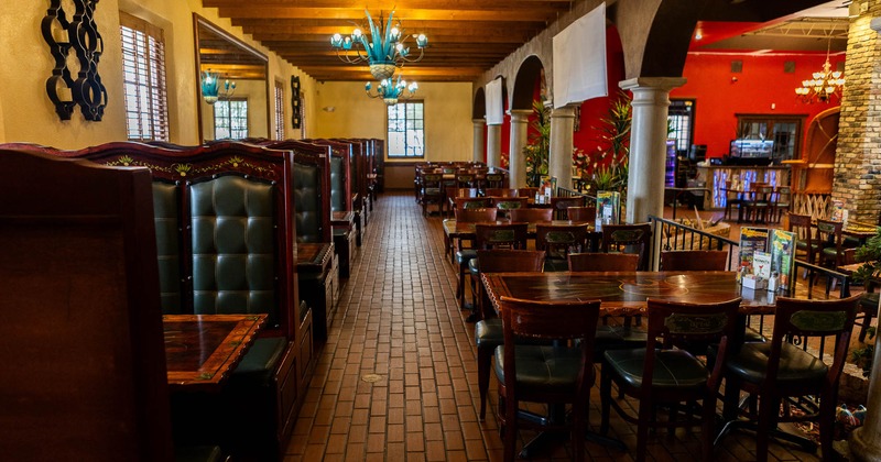 Interior, booths on the left and tables and chairs on the right