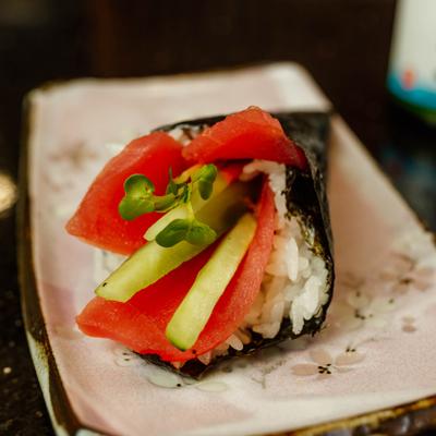 Close-up of a sushi hand roll with tuna and cucmber.