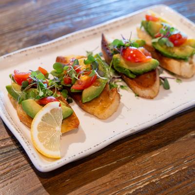 Toasted french baguette topped with fresh avocado, everything bagel seasoning, grape tomatoes and microgreens.