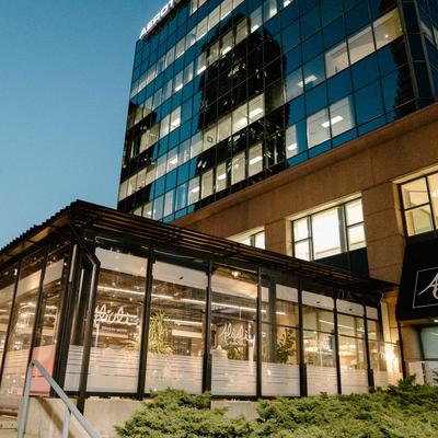 Restaurant exterior with a glass front.