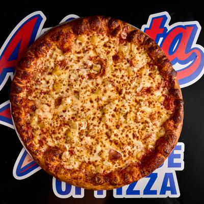 Hawaiian pizza, overhead view.