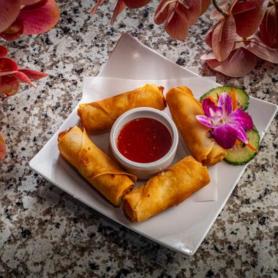 Crispy spring rolls with dipping sauce.