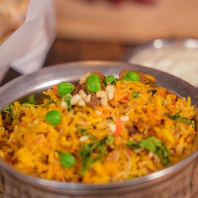 Lamb Biryani, with basmati rice, herbs, and spices.