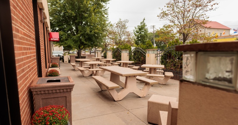 Exterior, patio, wooden tables and bench seating