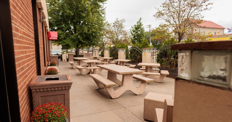 Exterior, patio, wooden tables and bench seating