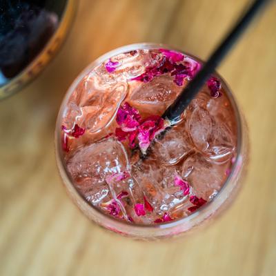 Nittolos Spritz garnished with edible rose petals.