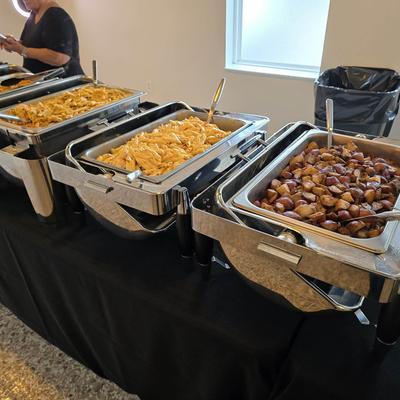 Serving containers with various foods.