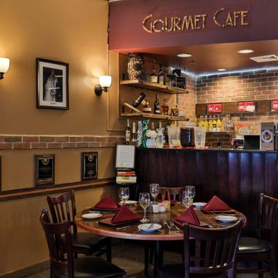 View of the table set for dining next to a bar counter.