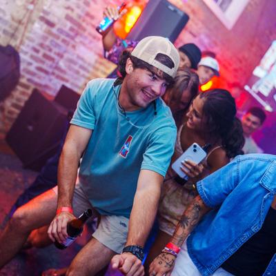 People dancing and having fun on the dance floor.