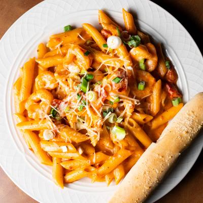 diablo pasta served with a salad or soup and a breadstick, a local favorite.