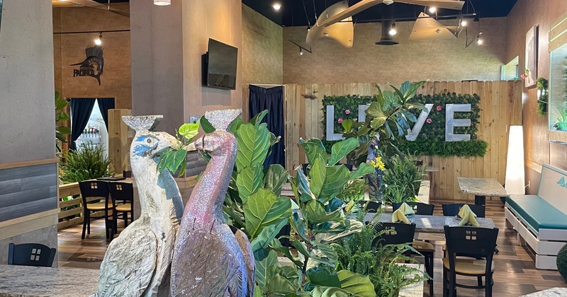 Dining area with tables and green napkins