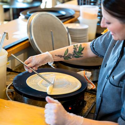 Employee making a crepe.