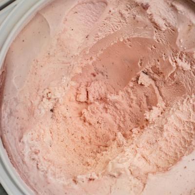 Strawberry ice cream, refrigerated, close-up.