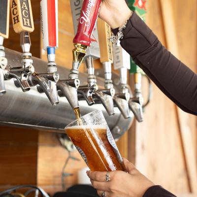 Beer being poured from the tap into a glass.